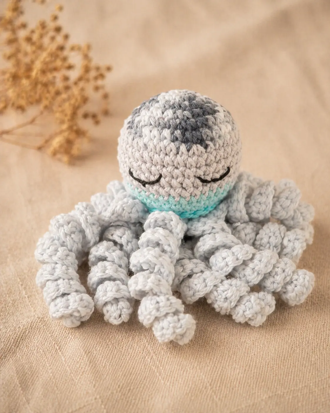 Doudou pieuvre gris