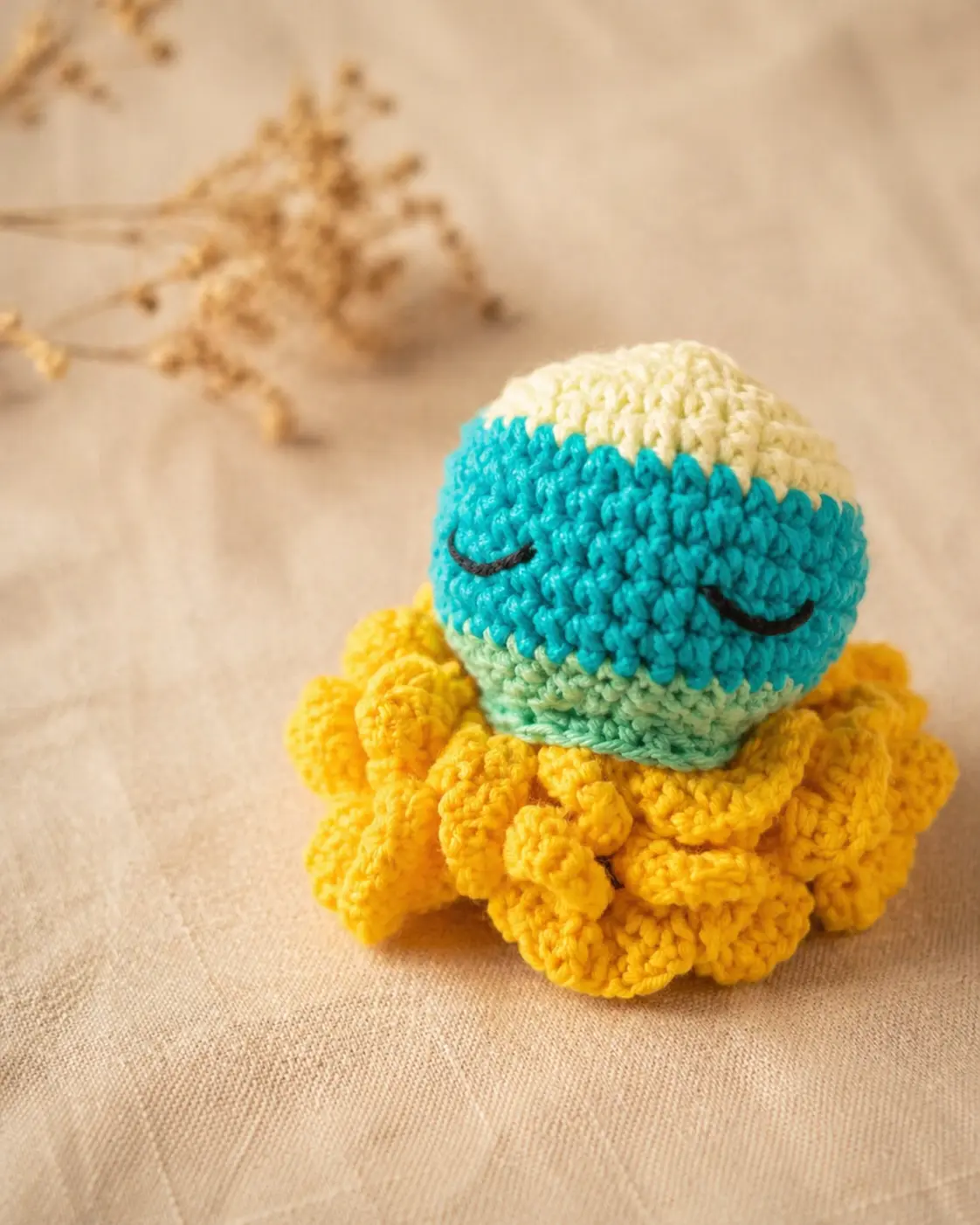 Doudou pieuvre jaune, vert et bleu