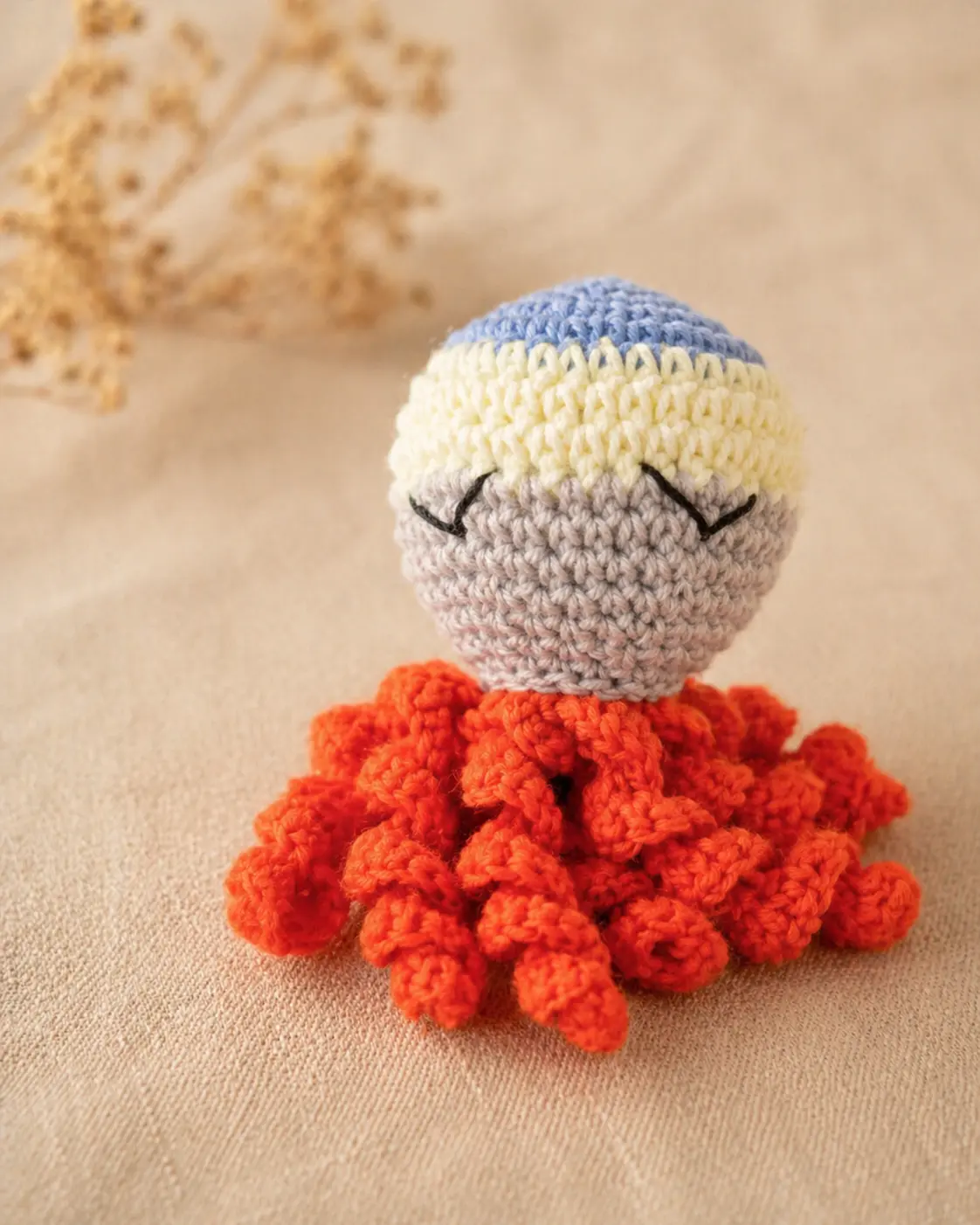 Doudou pieuvre orange et marron